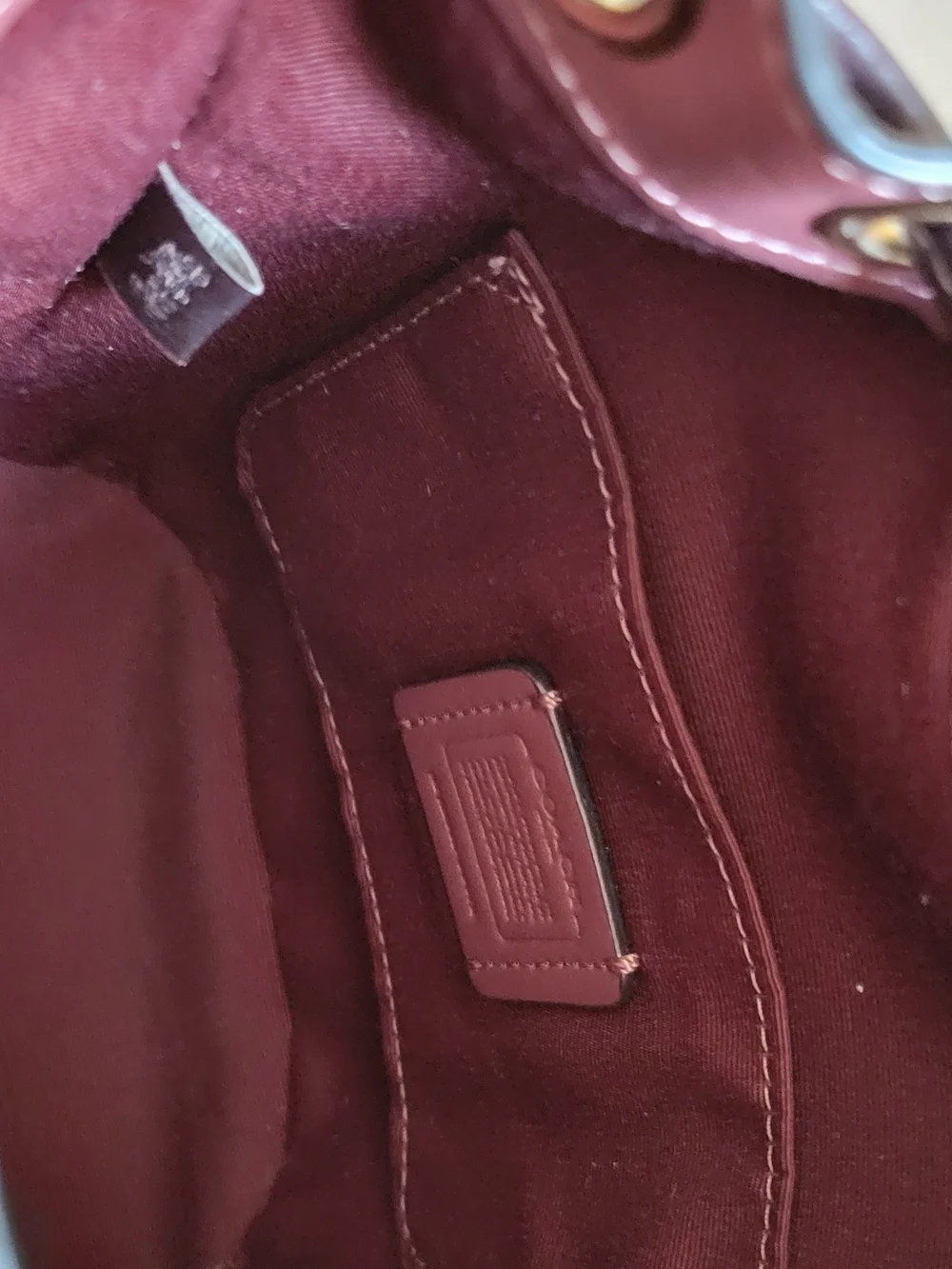 NWOT Coach burgundy Dempsey bucket bag with adjustable drawstring,